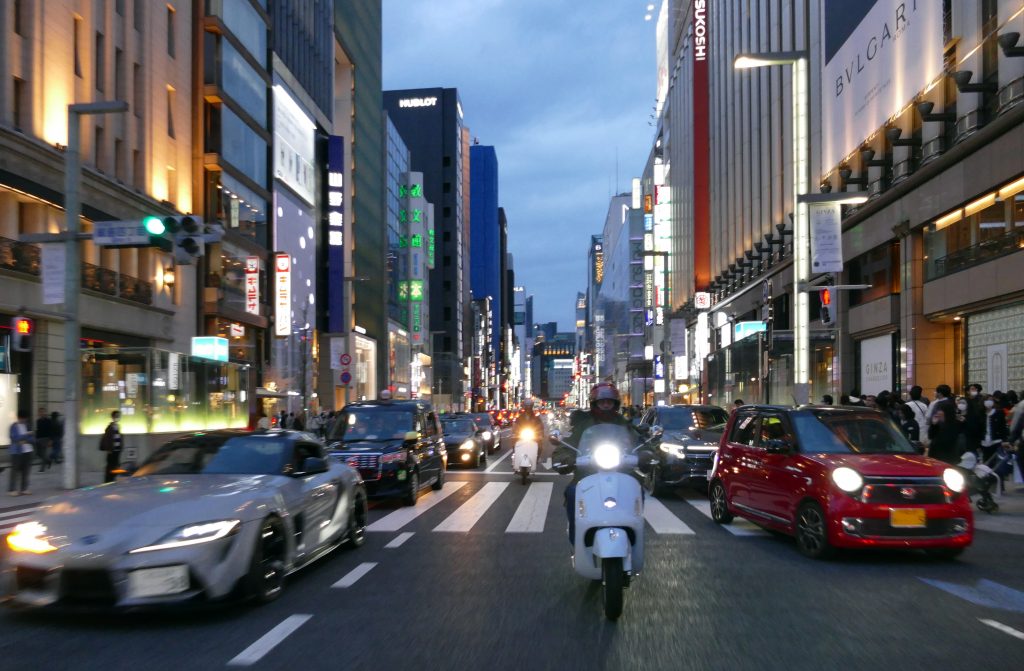 Riding through Ginza with the Vespa Club of Japan